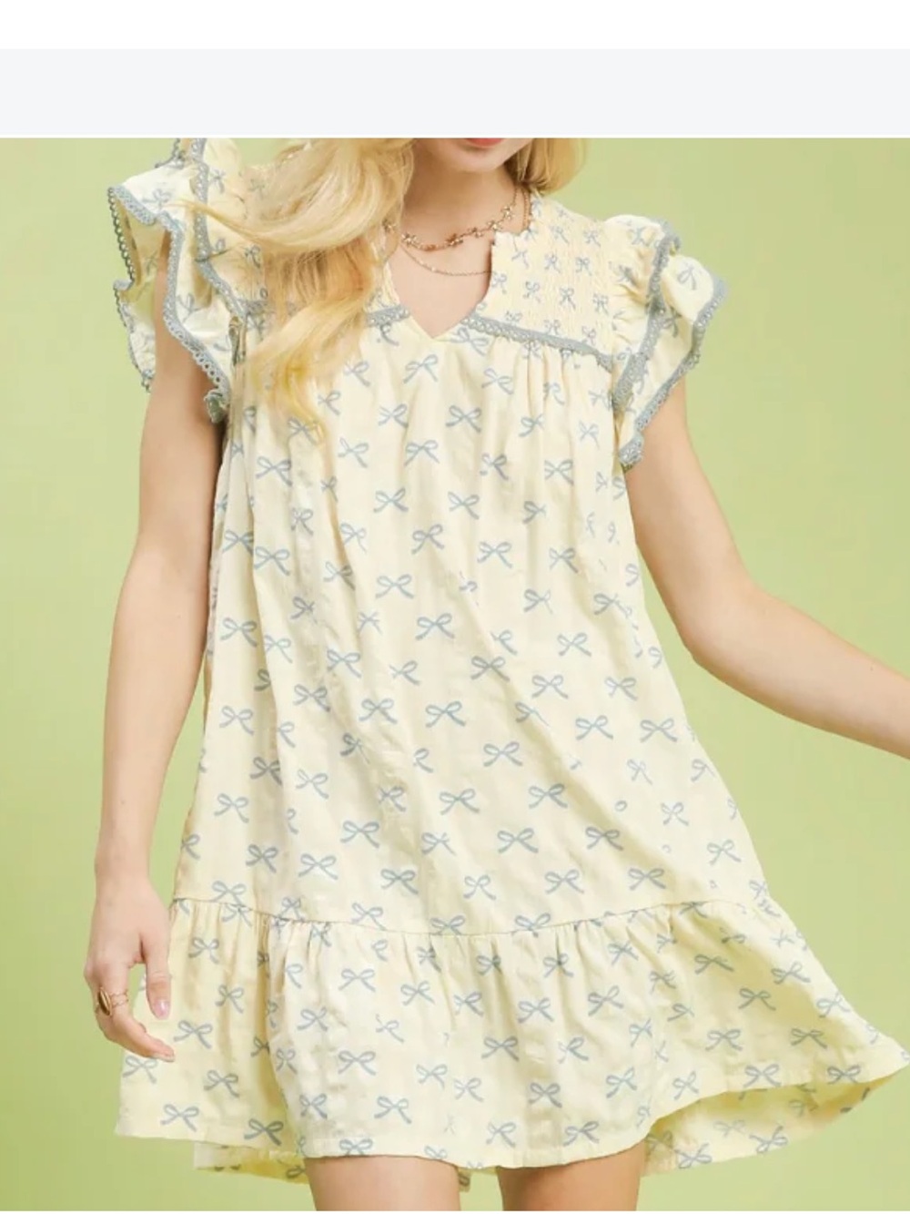 Umgee Babydoll Cream Dress with Blue Bow  Print size large. Fun and Flirty